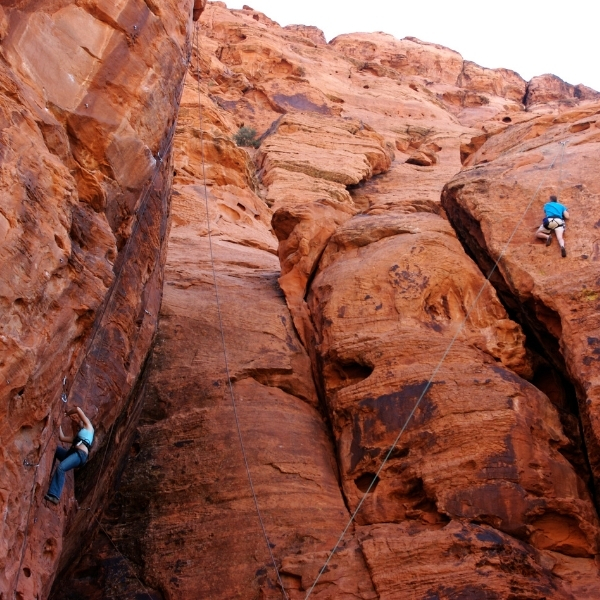 two rock climbers on canyon rock